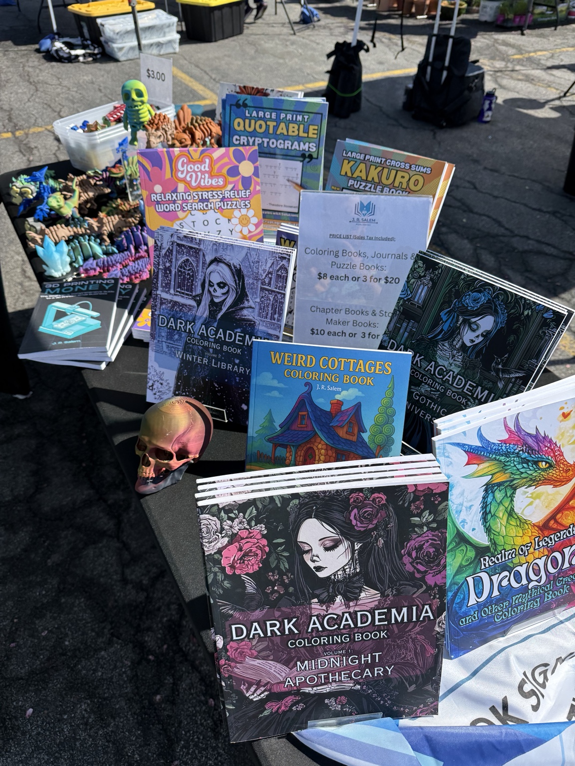J. R. Salem coloring, puzzle, and activity books displayed at a local event